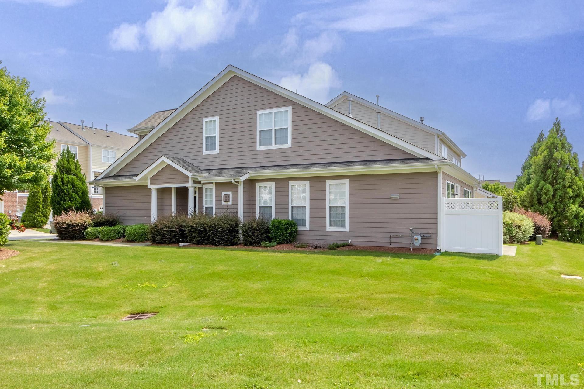 10114 Falls Meadow Court Raleigh, NC 27617 - Photo 52 of 53 a front view of a house with a yard