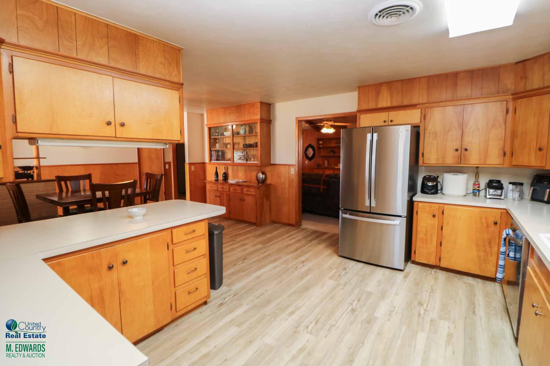 312 East 18th Street Littlefield, TX 79339 - Photo 3 of 14 a kitchen with stainless steel appliances a refrigerator a stove a sink dishwasher and a refrigerator