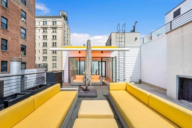 a view of a swimming pool with a lounge chairs