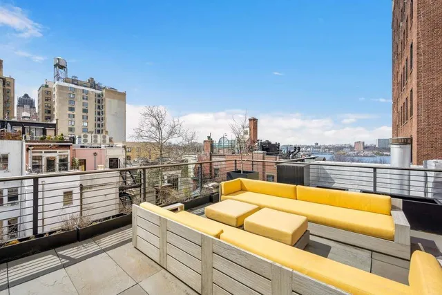 a view of a terrace with sitting area