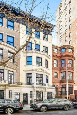 a front view of a building with lot of windows