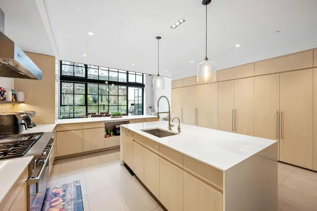 a very nice looking kitchen with a large window