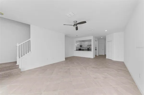 a view of a room with a refrigerator
