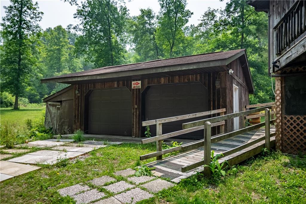 2738 Valley Road Mercer, PA 16137 - Photo 14 of 27 a view of backyard with wooden fence and large trees