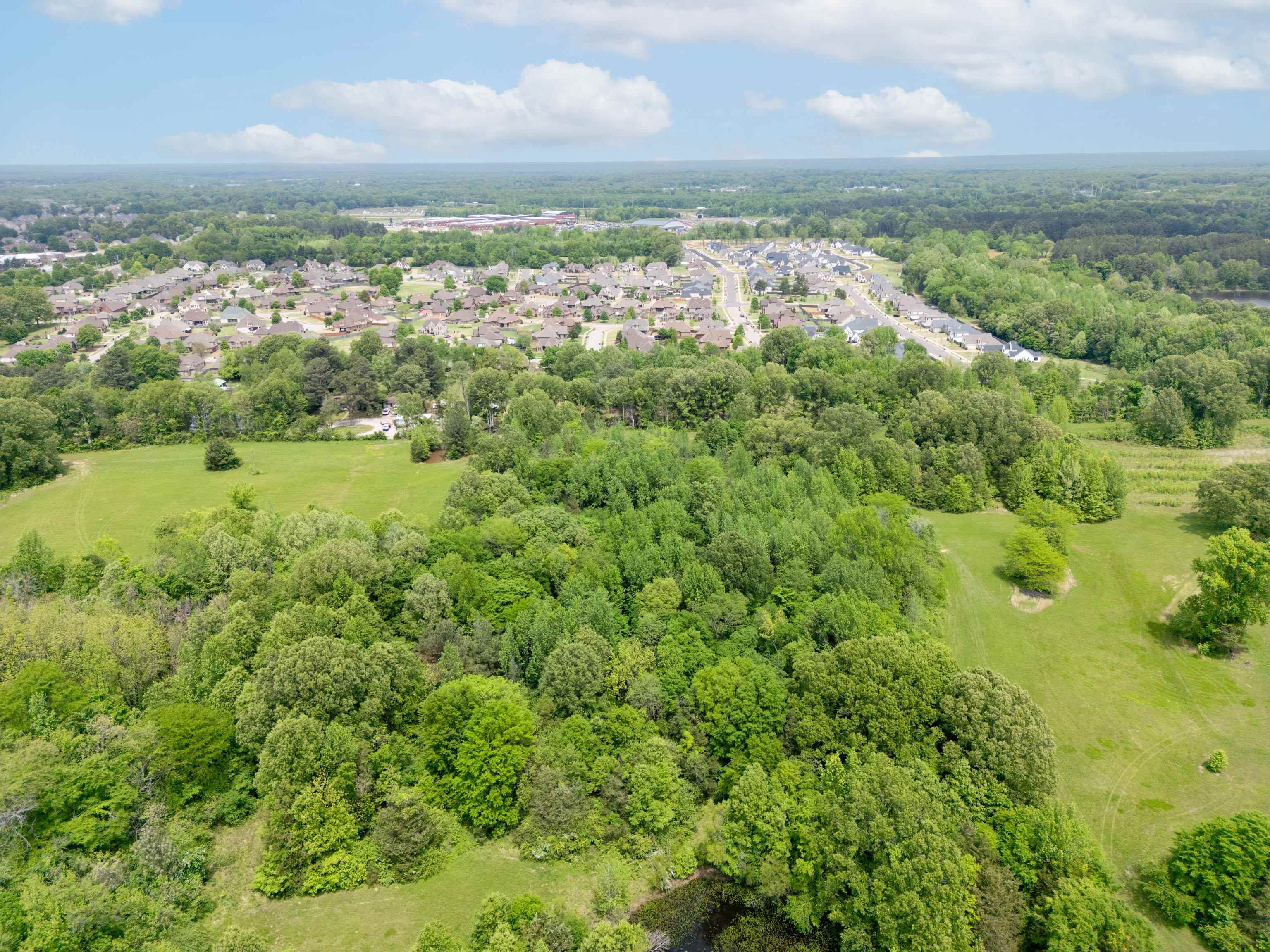 1492 Sycamore Road Collierville, TN 38017 - Photo 10 of 18 an aerial view of residential houses with outdoor space and trees