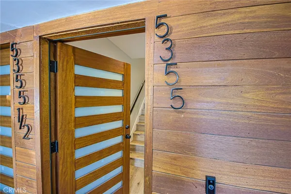 a view of a door and a window