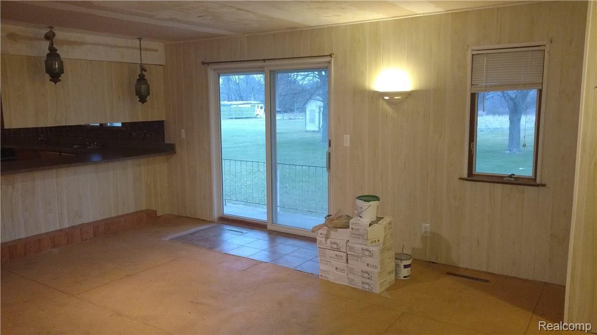 10191 Elms Road Montrose, MI 48457 - Photo 13 of 37 Very spacious Family Room with Doorwall to backyard