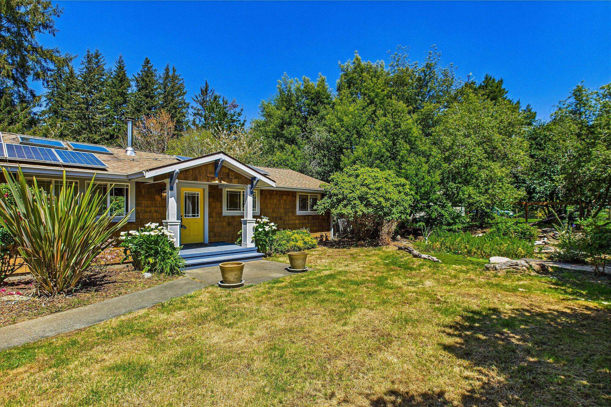 1945 Grange Road McKinleyville, CA 95519 - Photo 6 of 62 a front view of a house with a yard