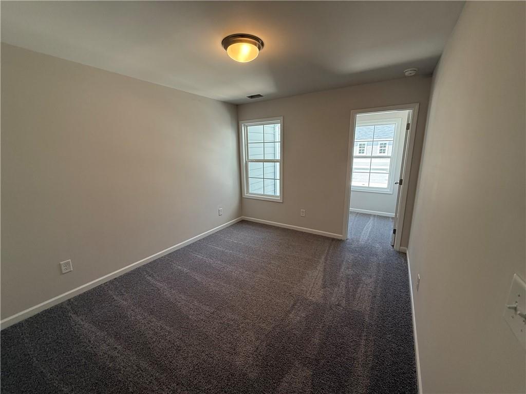 5143 Longview Run Decatur, GA 30035 - Photo 17 of 17 an empty room with windows