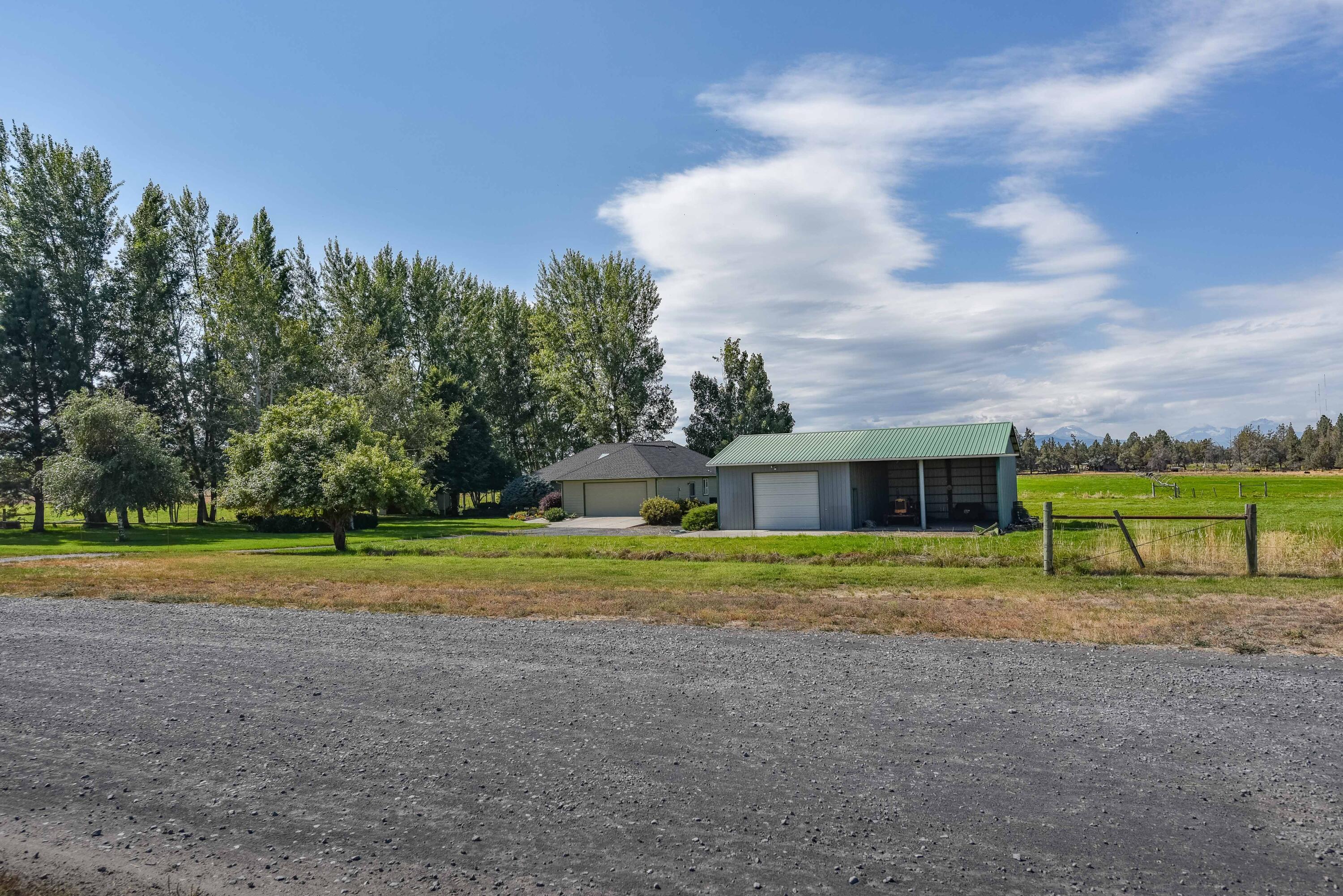 63475 Cricketwood Road Bend, OR 97701 - Photo 40 of 64 a view of a house with a yard and sitting area