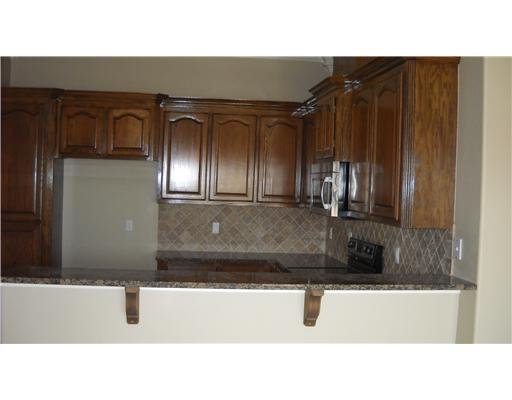4750 Grand Junction Drive, Unit 28 Corpus Christi, TX 78413 - Photo 3 of 6 a bathroom with a sink and a mirror