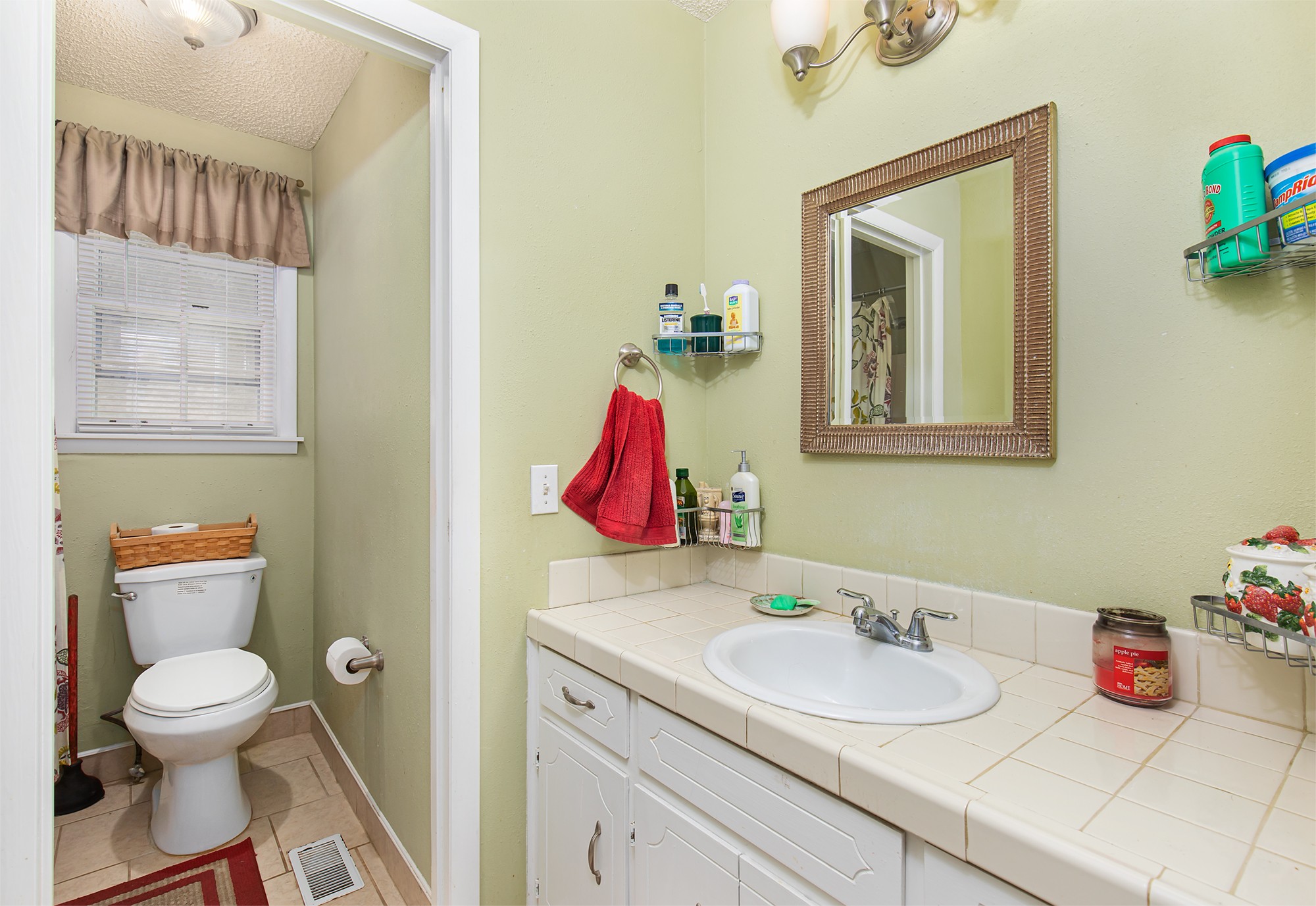 3114 Tyree Springs Road Hendersonville, TN 37075 - Photo 13 of 18 a bathroom with a toilet sink and mirror