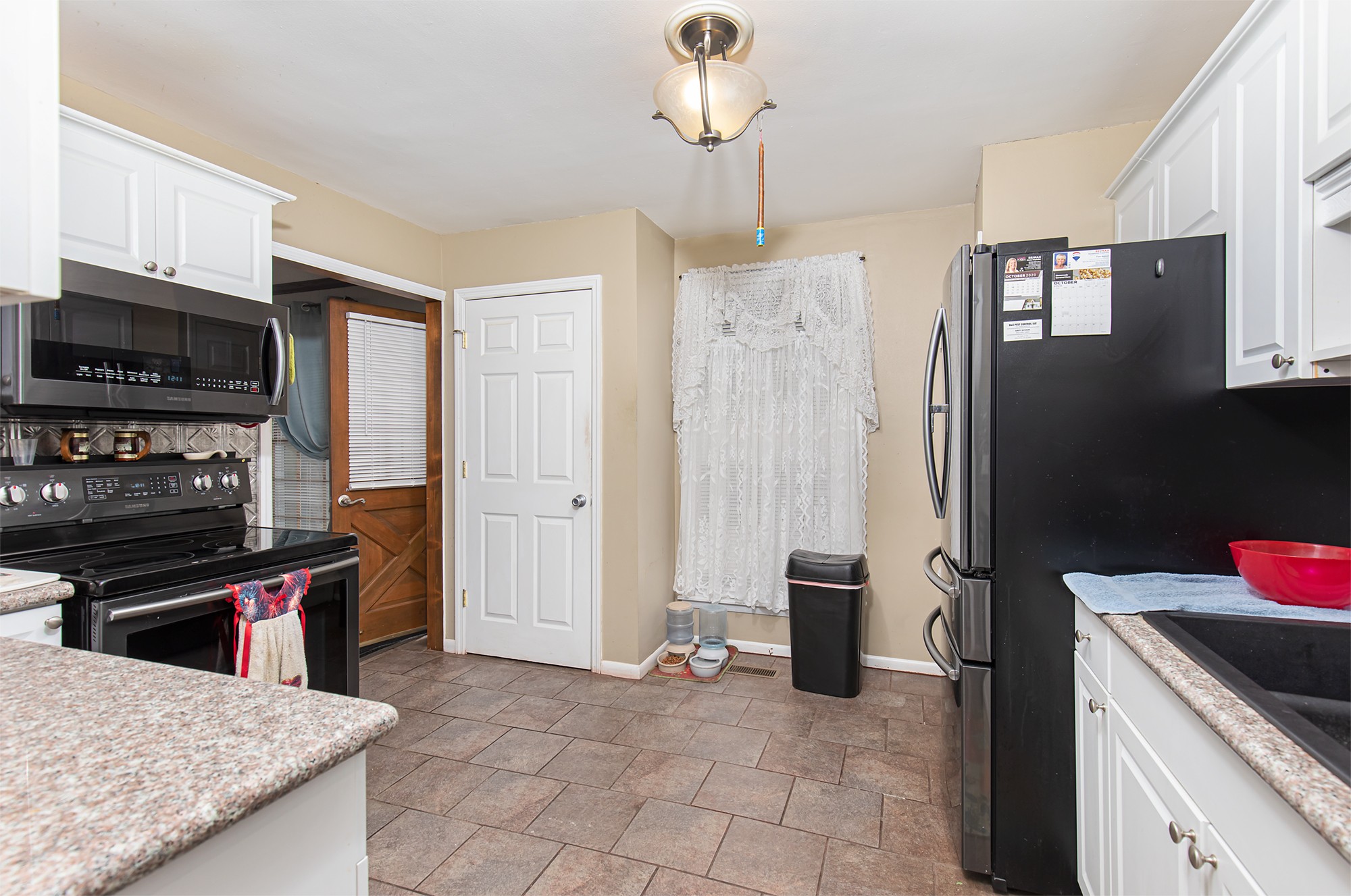 3114 Tyree Springs Road Hendersonville, TN 37075 - Photo 7 of 18 a kitchen with stainless steel appliances granite countertop a refrigerator and a stove