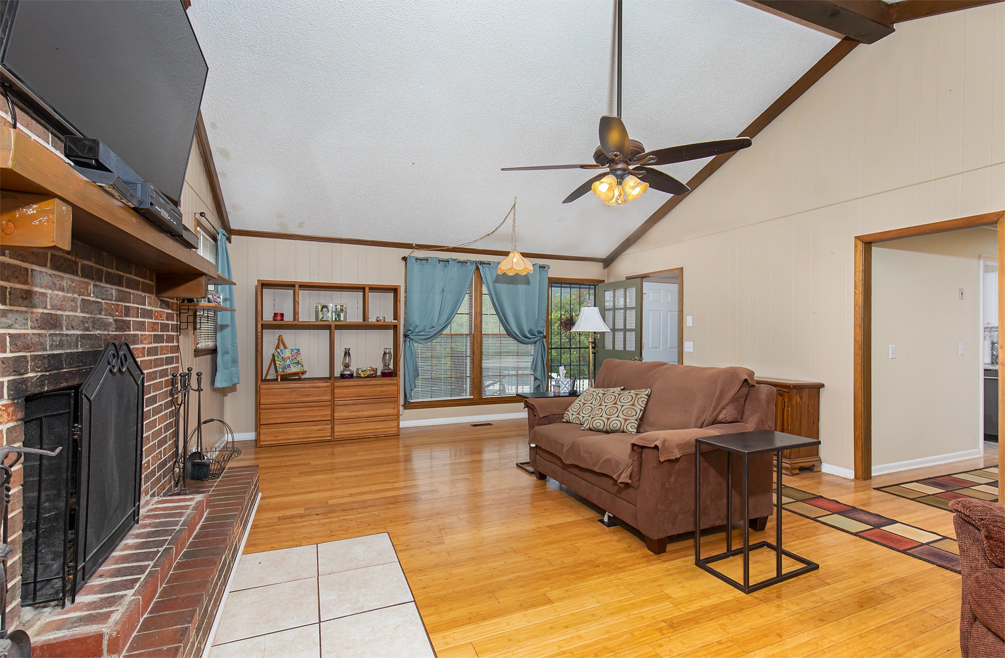 3114 Tyree Springs Road Hendersonville, TN 37075 - Photo 8 of 18 a living room with furniture a rug and a fireplace