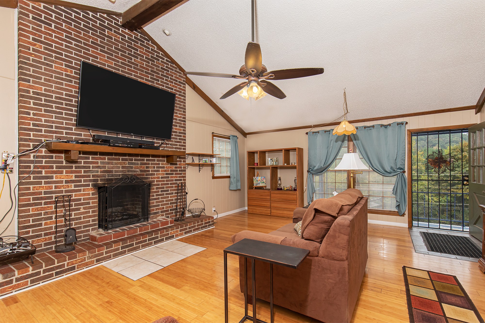 3114 Tyree Springs Road Hendersonville, TN 37075 - Photo 9 of 18 a living room with furniture a flat screen tv and a fireplace