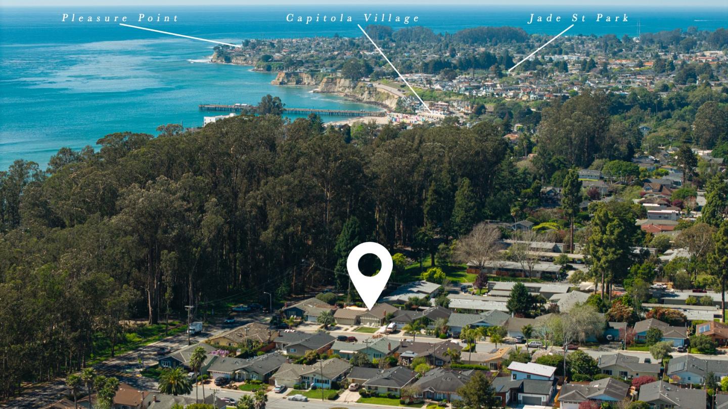 105 Wesley Street Capitola, CA 95010 - Photo 49 of 55 a backyard of a house with lots of green space and lake view