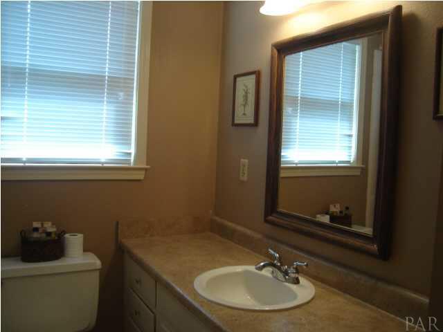 3960 McClellan Road Pensacola, FL 32503 - Photo 22 of 24 Newly updated vanities, lighting, & faucets in master bathroom