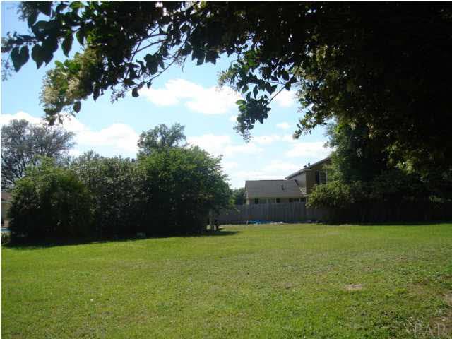 3960 McClellan Road Pensacola, FL 32503 - Photo 8 of 24 Back side of lot looking toward garage and neighbors home