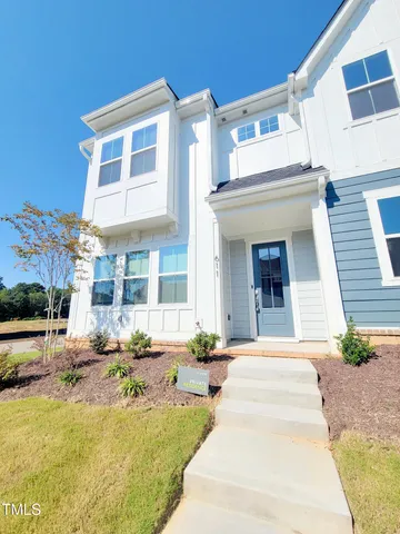 a view of a building with potted plants