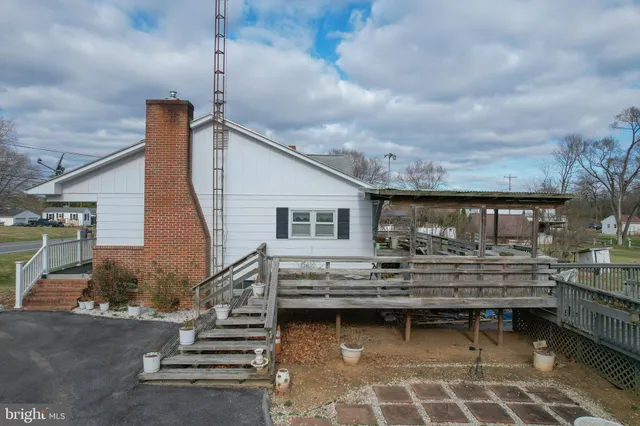 a view of house with a large window and wooden floor