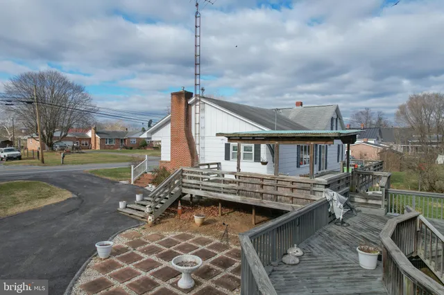 a view of a house with wooden deck