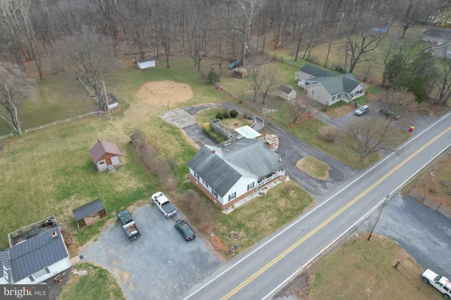 a aerial view of a house with a yard