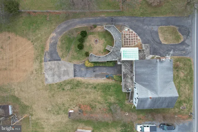 a view of a swimming pool with outdoor seating