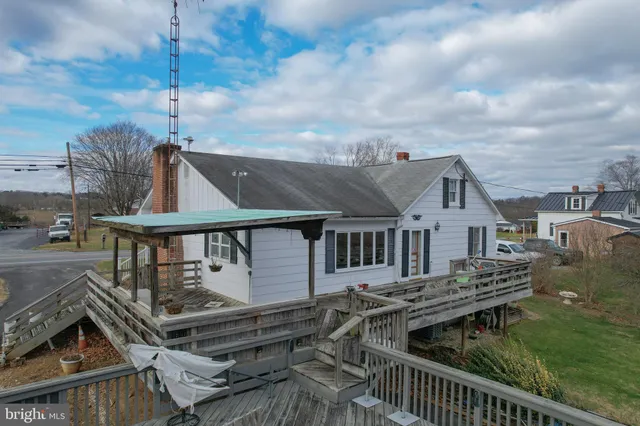 an aerial view of a house with lake view