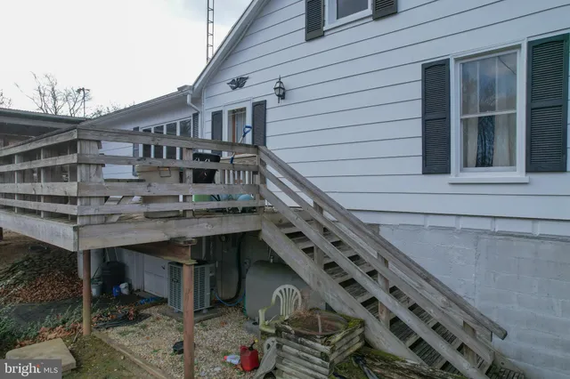 a front view of a house with a street