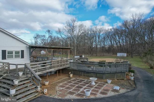 a view of a swimming pool with a patio
