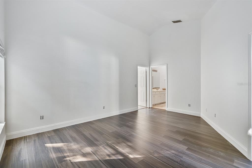 608 Bridge Creek Boulevard Ocoee, FL 34761 - Photo 12 of 17 a view of an empty room and wooden floor