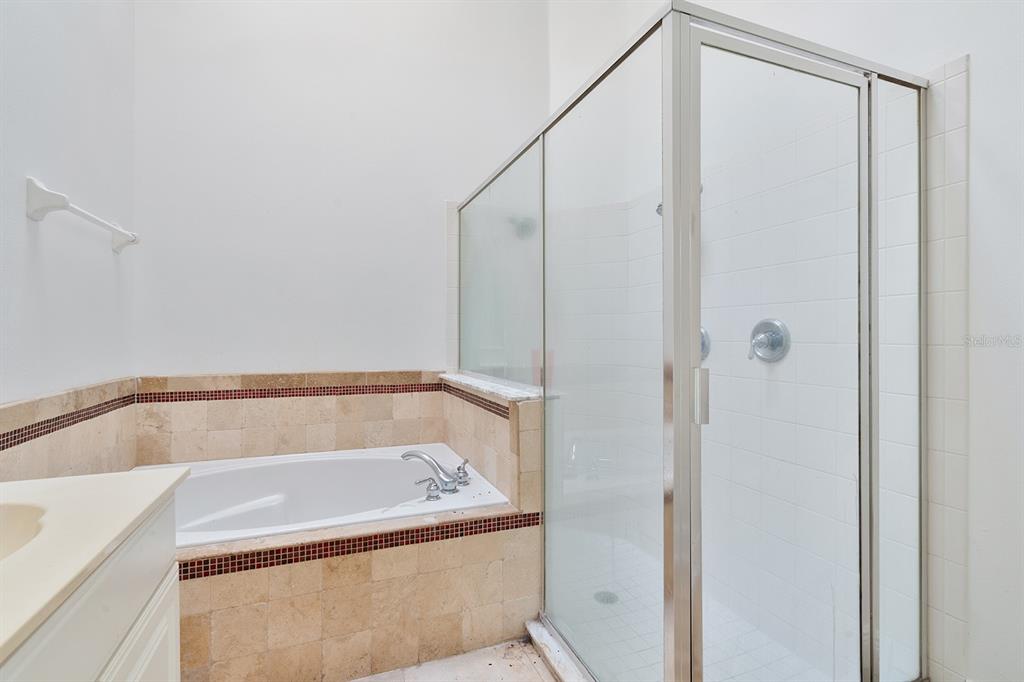 608 Bridge Creek Boulevard Ocoee, FL 34761 - Photo 15 of 17 a bathroom with a bath tub and shower