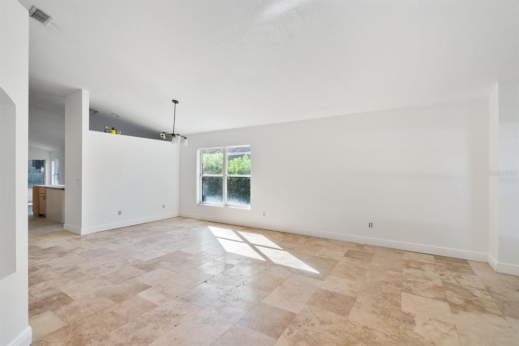 608 Bridge Creek Boulevard Ocoee, FL 34761 - Photo 6 of 17 an empty room with a empty space and windows