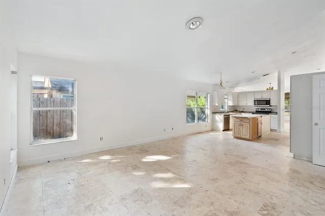 a view of a kitchen with a sink and a window