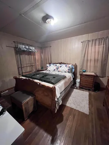 a bed sitting in a room next to a window