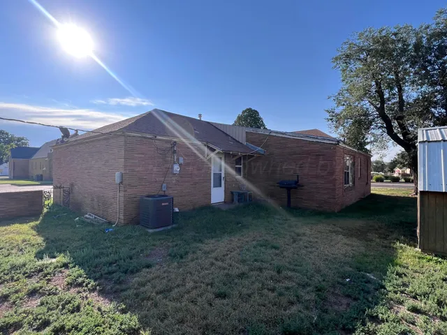 a house view with a backyard space