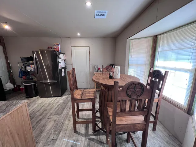 a view of a dining room with furniture