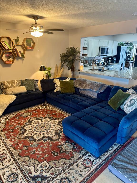 2379 Flamingo Way Winter Park, FL 32792 - Photo 11 of 25 a living room with a rug and a couch