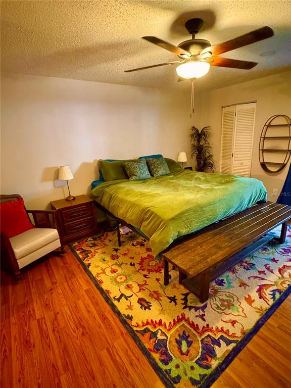 2379 Flamingo Way Winter Park, FL 32792 - Photo 17 of 25 a bedroom with a bed and wooden floor