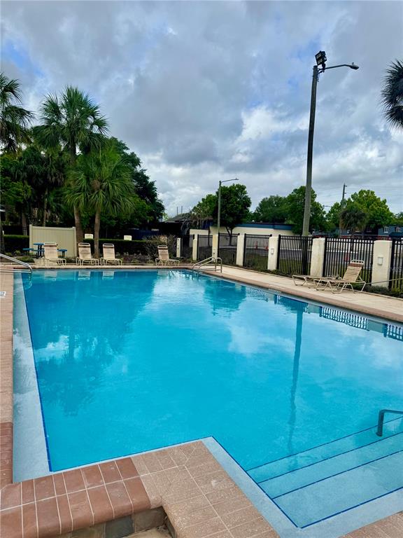 2379 Flamingo Way Winter Park, FL 32792 - Photo 21 of 25 a view of a swimming pool with a yard