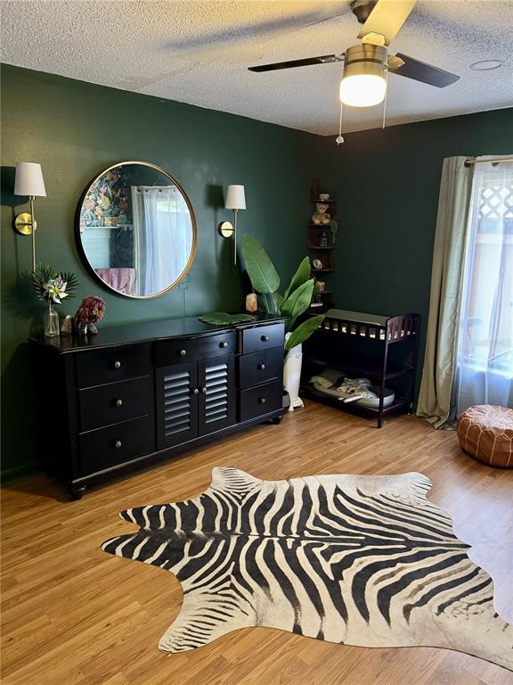2379 Flamingo Way Winter Park, FL 32792 - Photo 4 of 25 a living room with a mirror and a wooden floor