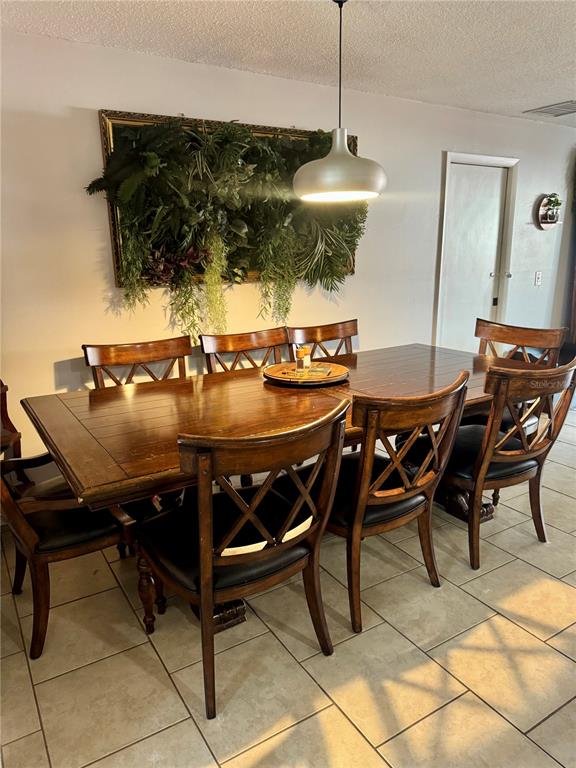 2379 Flamingo Way Winter Park, FL 32792 - Photo 7 of 25 a view of a dining room with furniture and chandelier