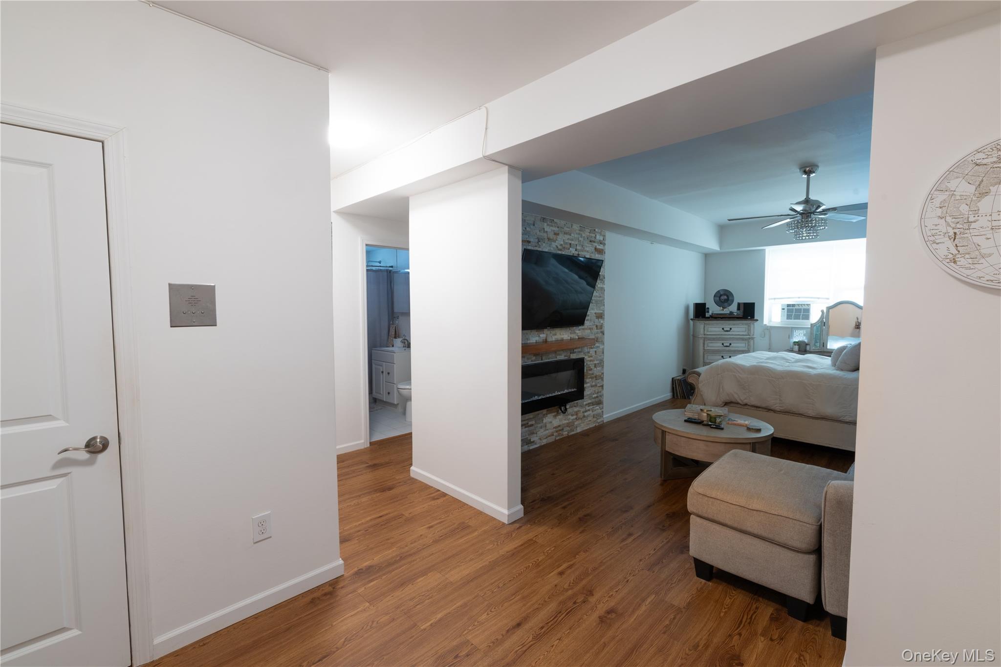525 Beach 138th Street, Unit A2 Queens, NY 11694 - Photo 3 of 12 a living room with furniture and a flat screen tv