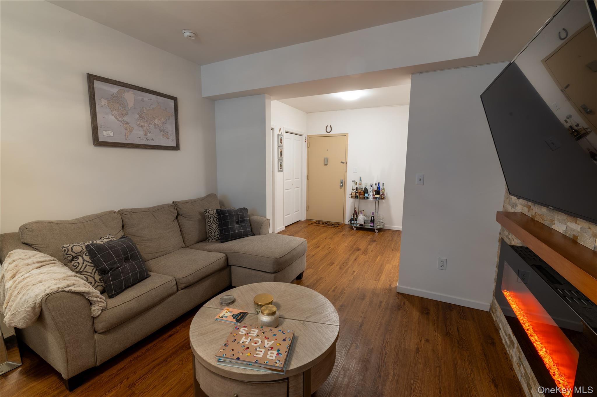 525 Beach 138th Street, Unit A2 Queens, NY 11694 - Photo 4 of 12 a living room with furniture and a fireplace