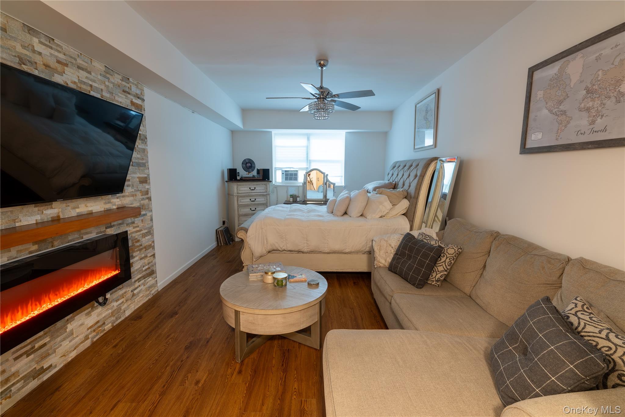 525 Beach 138th Street, Unit A2 Queens, NY 11694 - Photo 5 of 12 a living room with furniture and a flat screen tv