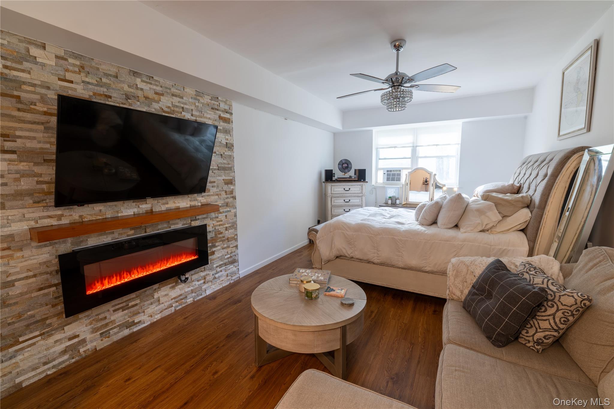 525 Beach 138th Street, Unit A2 Queens, NY 11694 - Photo 6 of 12 a living room with furniture and a flat screen tv