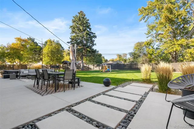a view of a backyard with sitting area