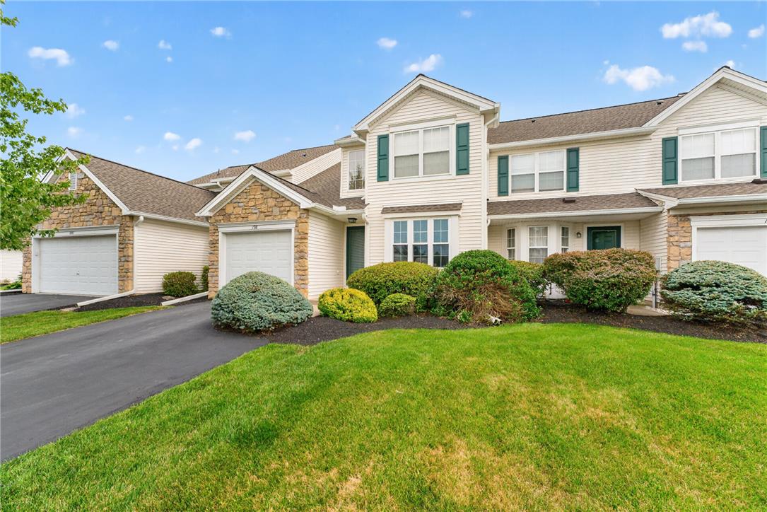 198 Park Ridge Drive Easton, PA 18040 - Photo 2 of 28 A classic exterior with stone accents and well-maintained landscaping presents a welcoming curb appeal.