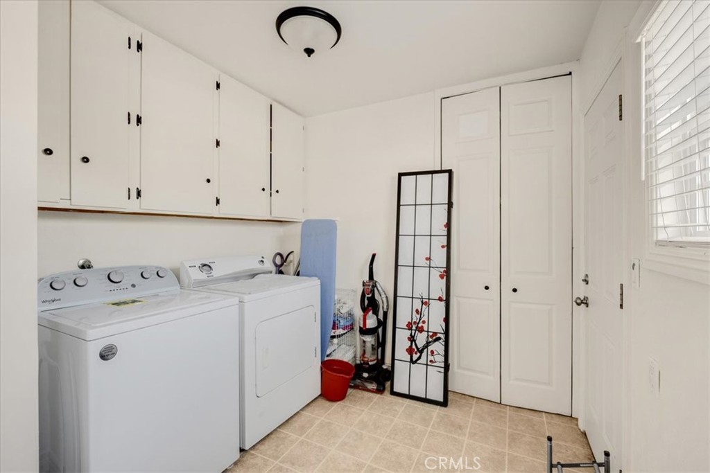 2183 Sinclair Street Pomona, CA 91767 - Photo 28 of 38 a view of storage room with washer and dryer