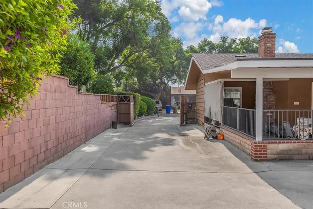 a view of a house with a garage and a yard
